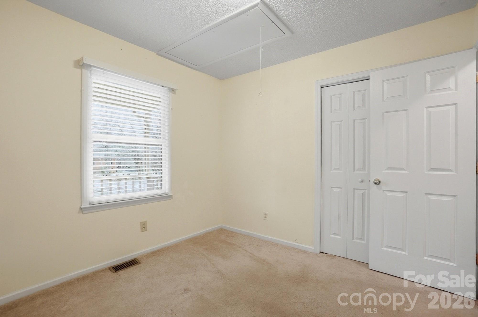 616 Durham Road Stanley, NC 28164 - Photo 30 of 42 a view of an empty room with a window