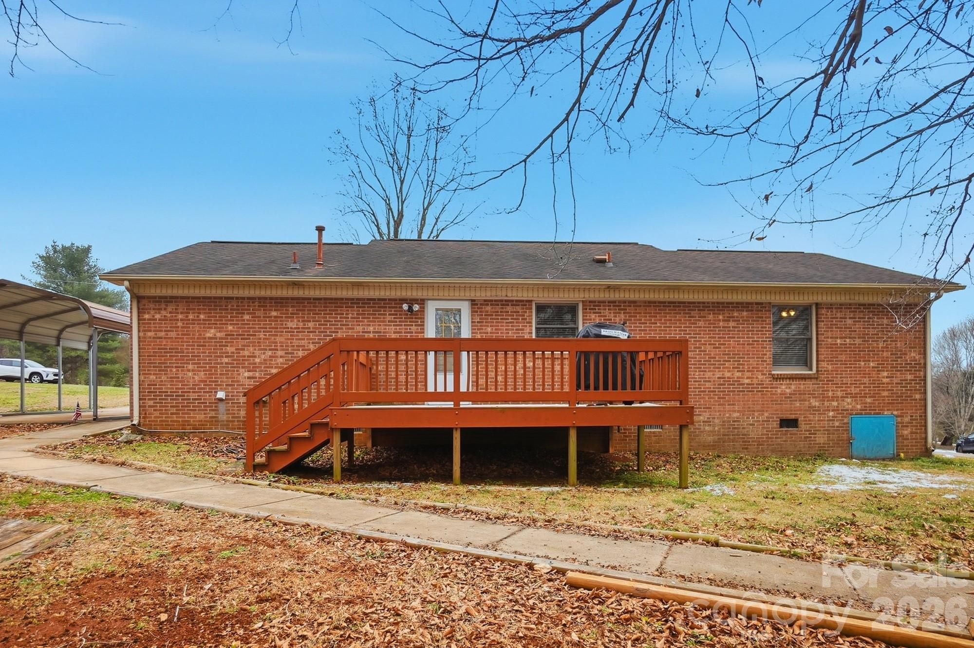 616 Durham Road Stanley, NC 28164 - Photo 36 of 42 a view of a backyard with a barbeque grill and plants