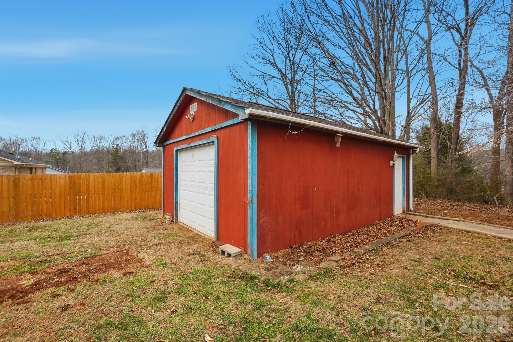 616 Durham Road Stanley, NC 28164 - Photo 38 of 42 a view of backyard with large tree and wooden fence