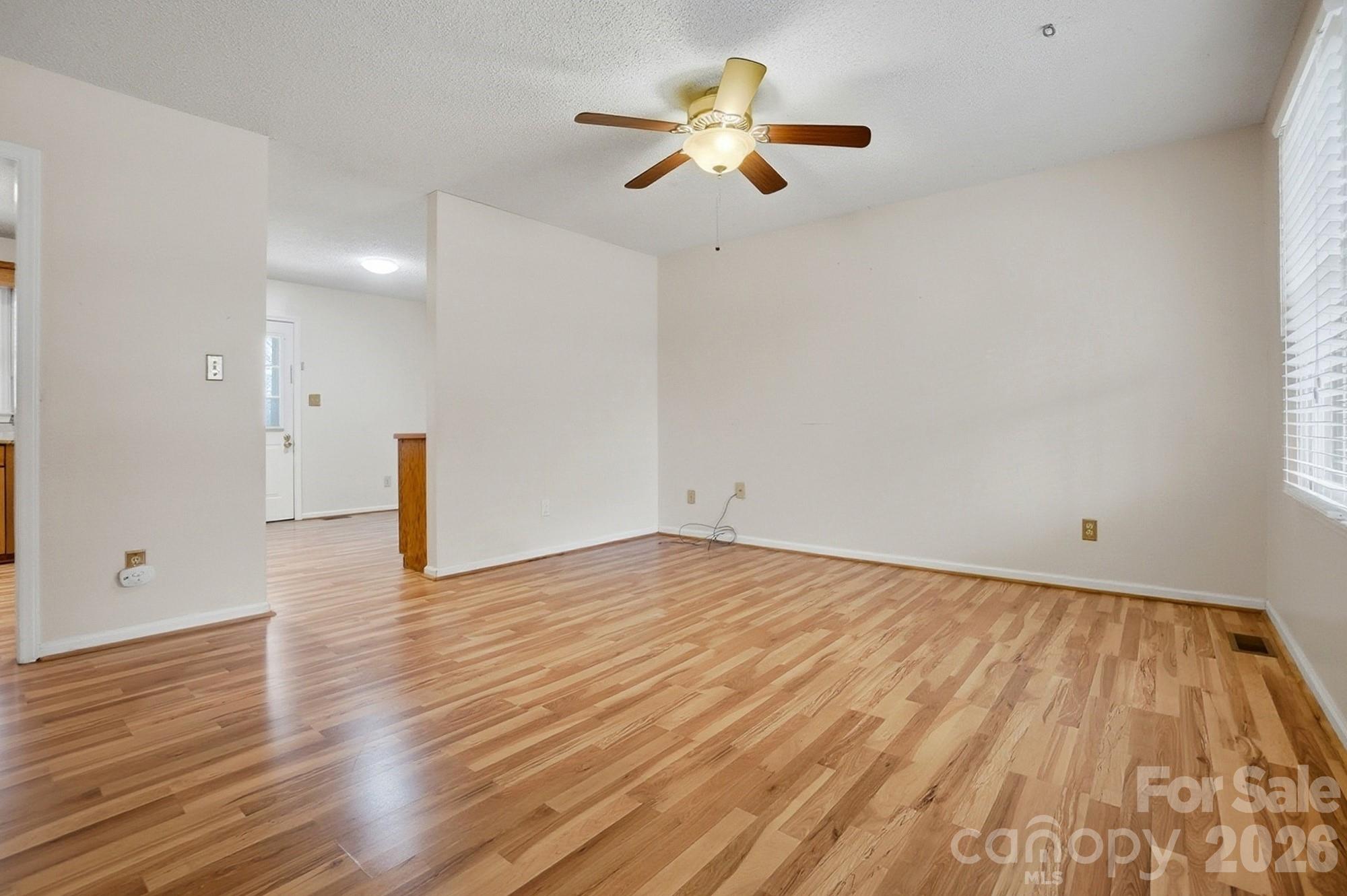 616 Durham Road Stanley, NC 28164 - Photo 6 of 42 a view of empty room with wooden floor