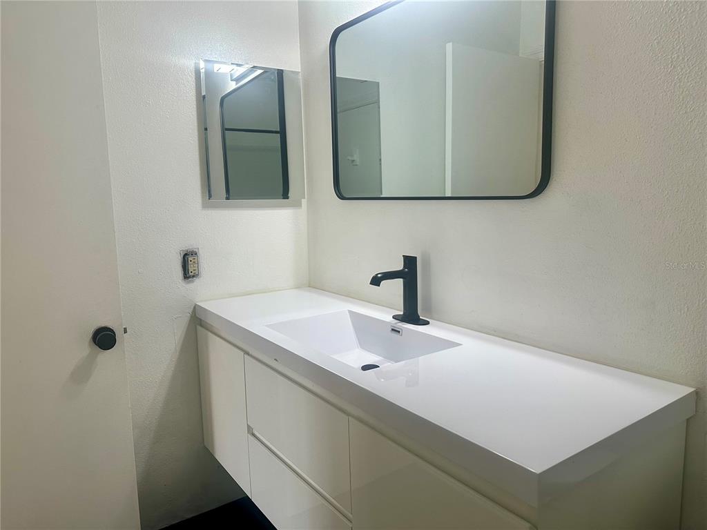 435 Wymore Road, Unit 207 Altamonte Springs, FL 32714 - Photo 9 of 17 a bathroom with a sink and a mirror