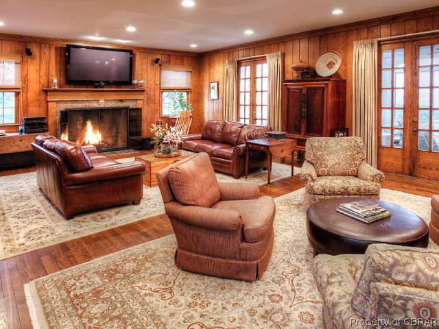 6736 Ware Neck Road Gloucester, VA 23061 - Photo 14 of 34 Spacious living room with gorgeous hearth, big views and again the beautiful American Chestnut flooring.