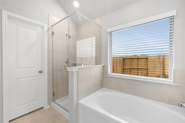 a white bath tub sitting next to a window