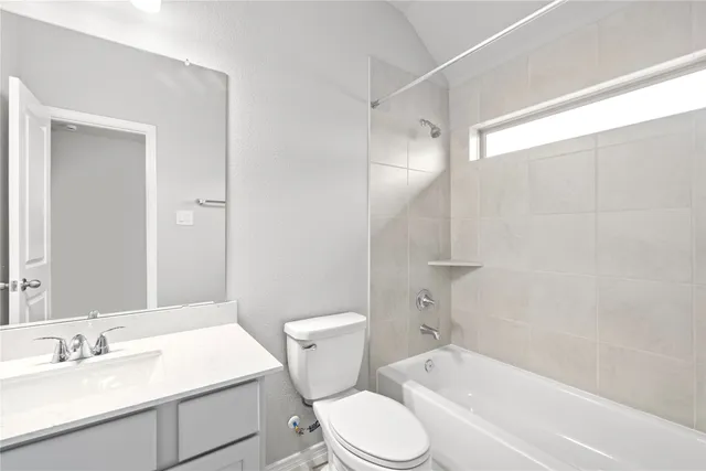 a bathroom with a sink a toilet and a bathtub