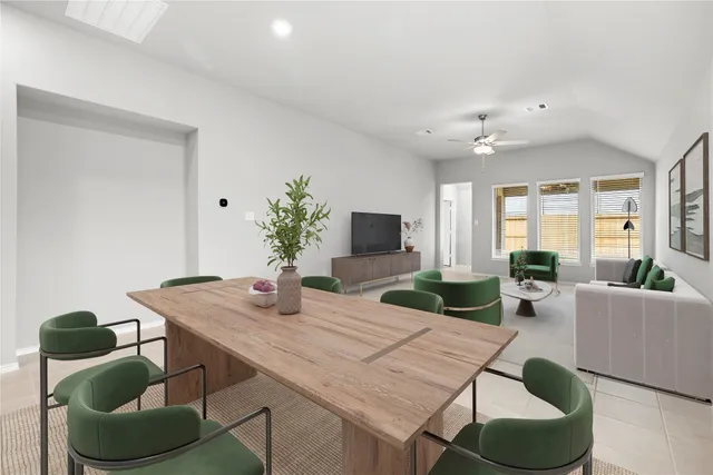 a dining room with furniture and wooden floor