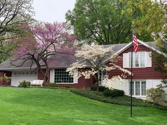 3307 Landstrom Road Rockford, IL 61107 - Photo 1 of 40 a front view of a house with a garden and plants