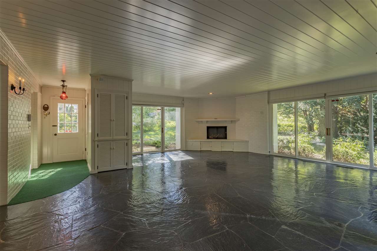 3307 Landstrom Road Rockford, IL 61107 - Photo 15 of 40 a view of empty room with floor to ceiling window and wooden floor