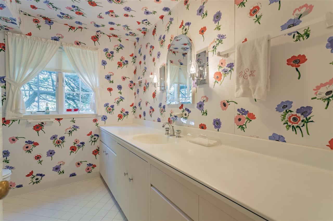 3307 Landstrom Road Rockford, IL 61107 - Photo 25 of 40 a bathroom with a sink and a curtain