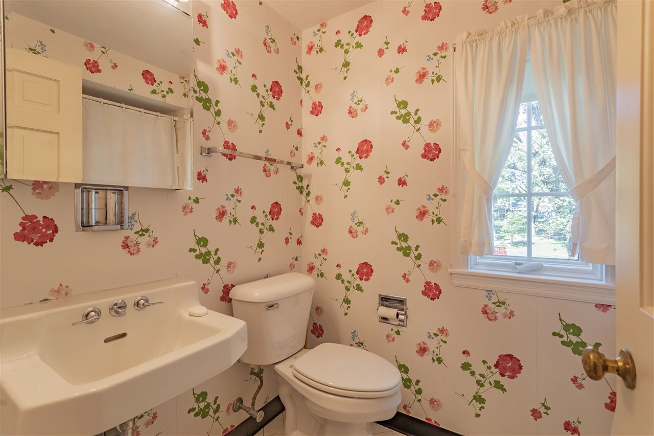 3307 Landstrom Road Rockford, IL 61107 - Photo 27 of 40 a bathroom with a sink toilet and shower