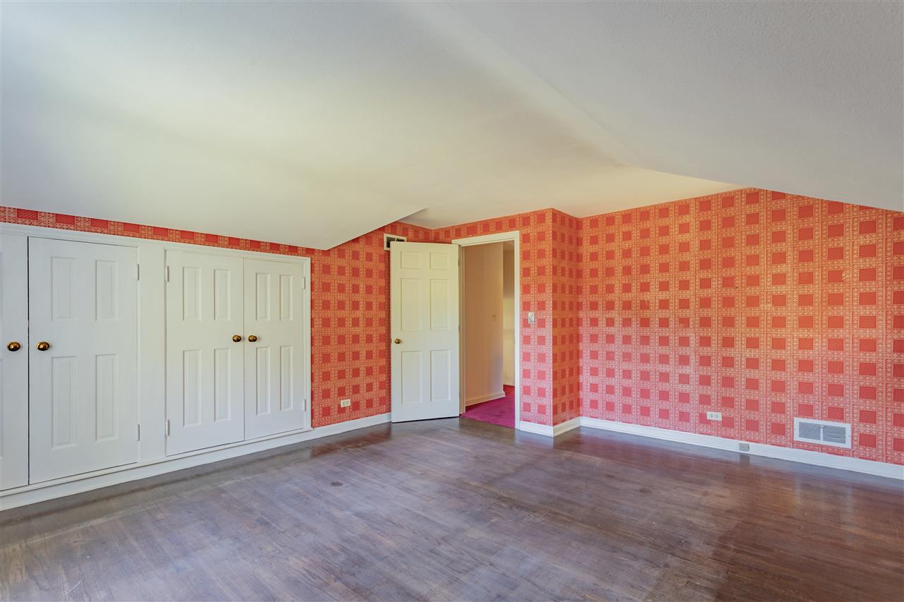 3307 Landstrom Road Rockford, IL 61107 - Photo 29 of 40 an empty room with wooden floor and windows