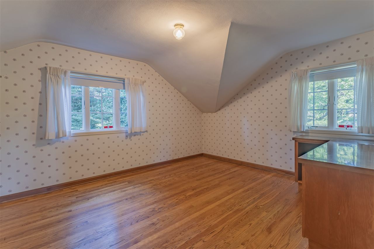 3307 Landstrom Road Rockford, IL 61107 - Photo 32 of 40 an empty room with wooden floor and windows