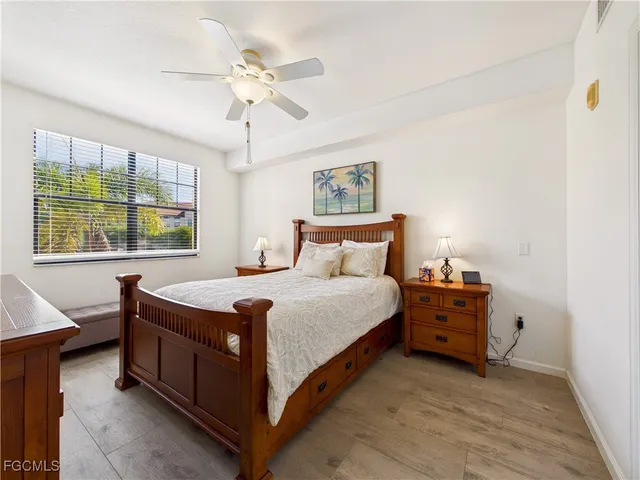 a bedroom with a bed and a table