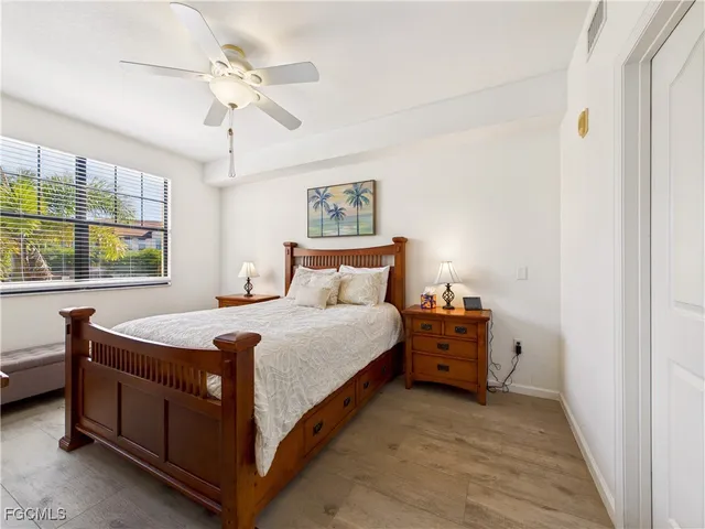 a bed room with a bed and a window