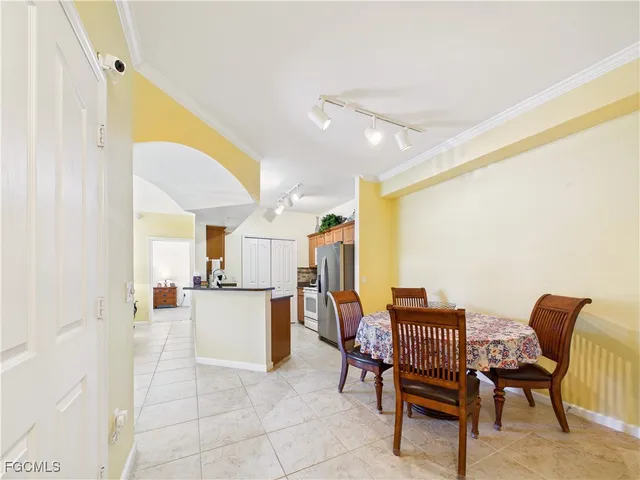 a kitchen with a table and chairs