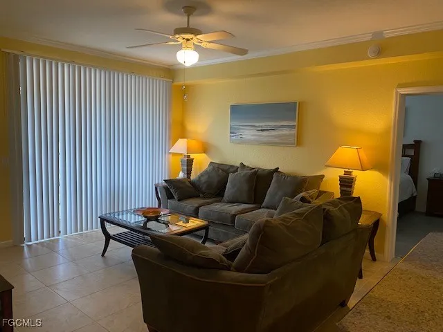 a living room with furniture and a lamp