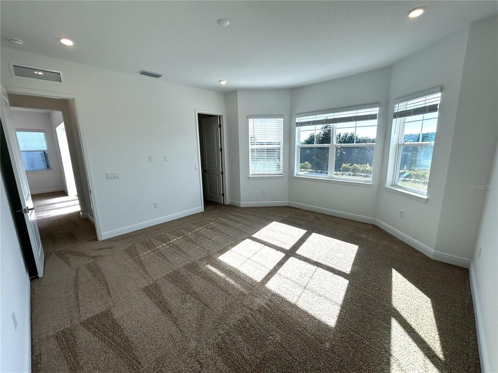 16017 Volterra Point Bella Collina, FL 34756 - Photo 11 of 30 a view of hallway with windows and chandelier