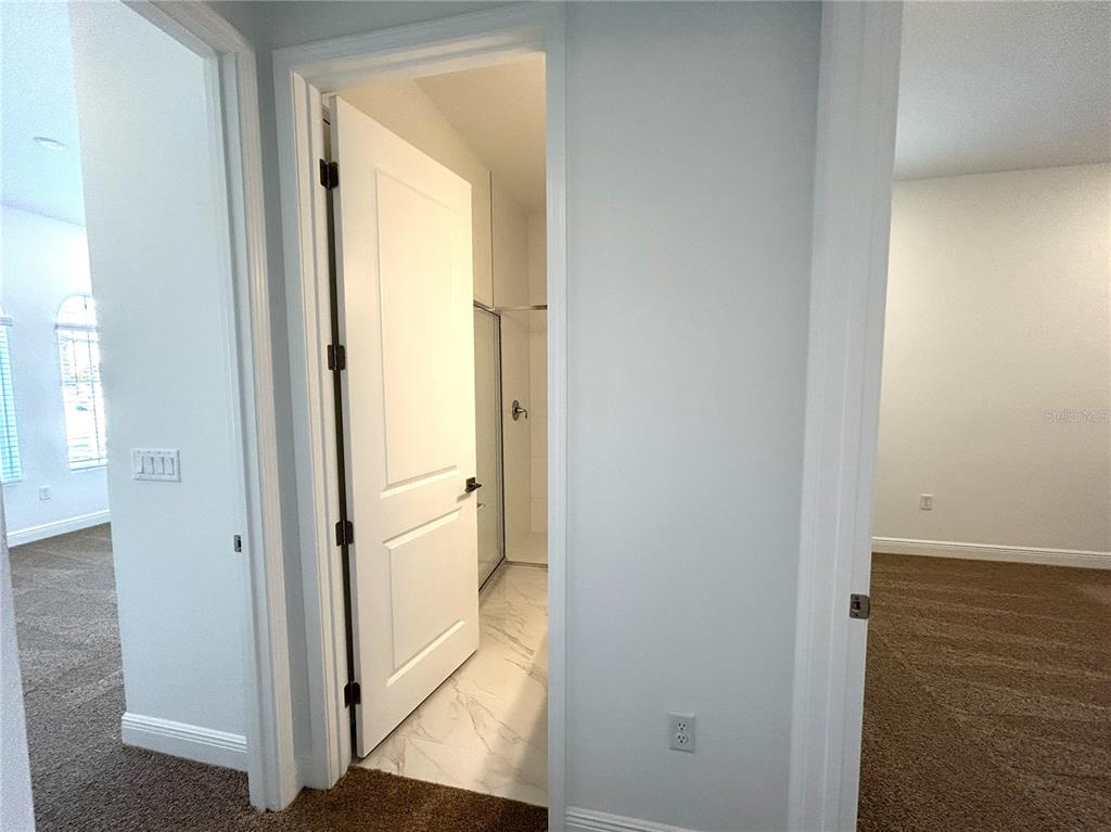 16017 Volterra Point Bella Collina, FL 34756 - Photo 14 of 30 a view of a bathroom from a hallway