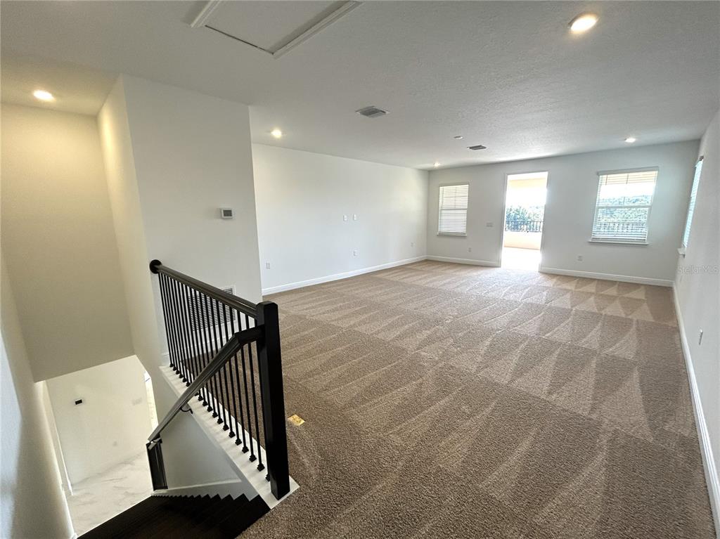 16017 Volterra Point Bella Collina, FL 34756 - Photo 19 of 30 a view of a hallway with window and stairs