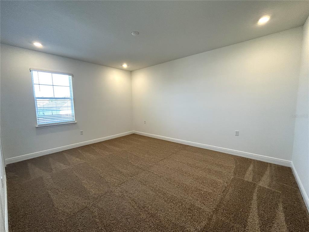 16017 Volterra Point Bella Collina, FL 34756 - Photo 21 of 30 an empty room with a window
