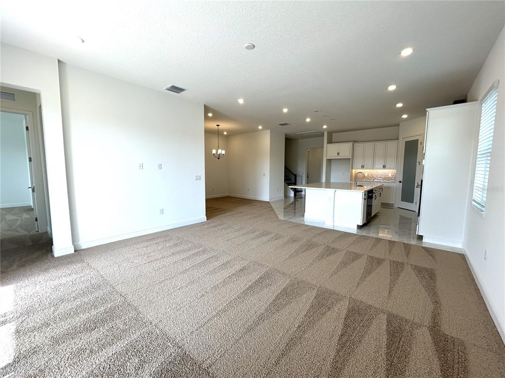 16017 Volterra Point Bella Collina, FL 34756 - Photo 6 of 30 a view of kitchen with a refrigerator oven a sink and a counter top space