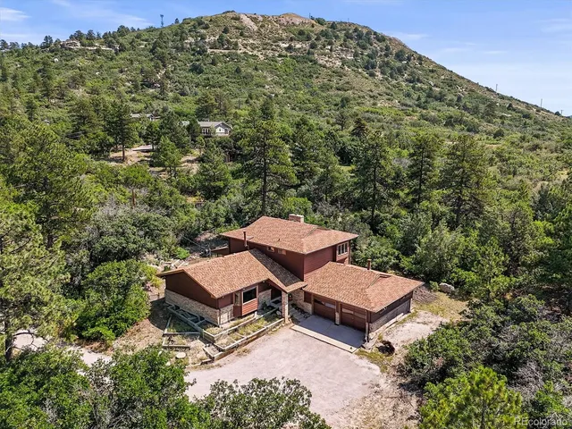 an aerial view of a house with a garden