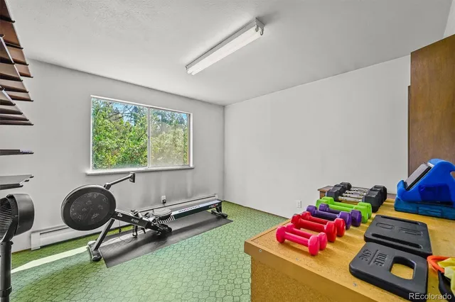 a living room with furniture toys and a window