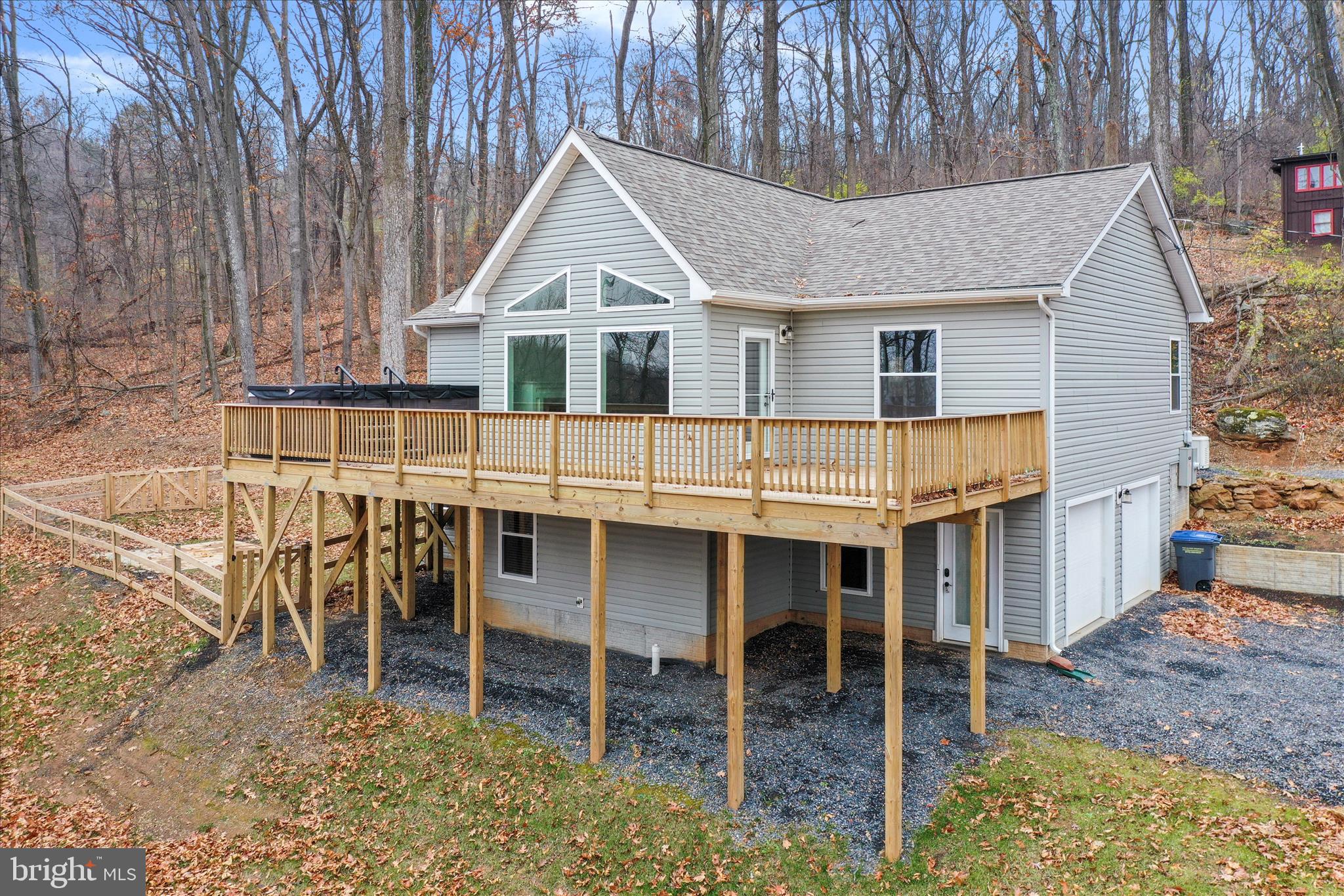 a white house with a table and chairs in front of it