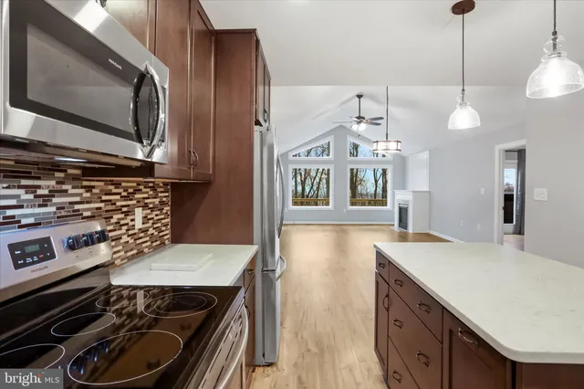 a kitchen with a stove and a microwave