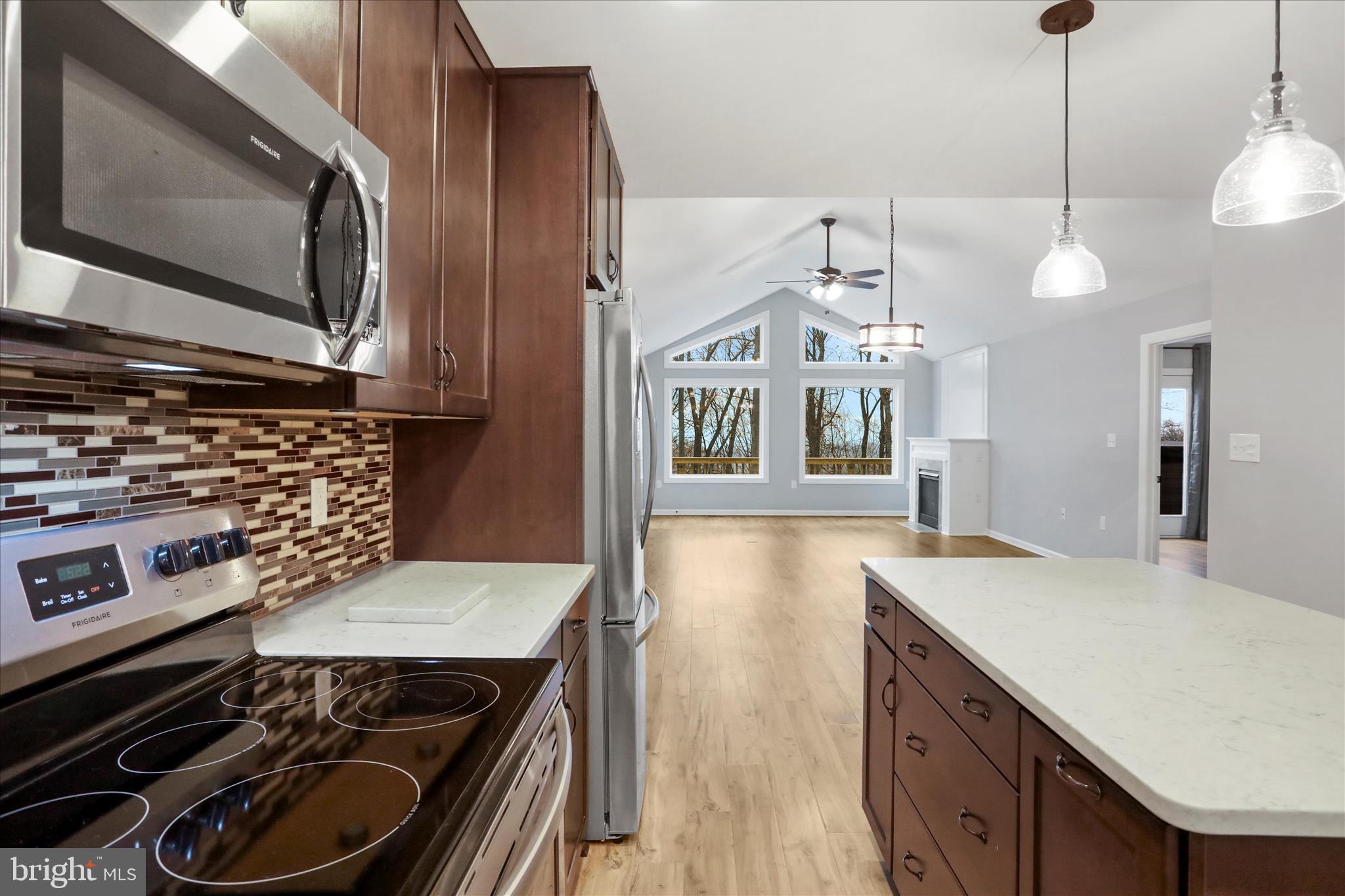 401 Bragg Drive Front Royal, VA 22630 - Photo 17 of 50 a kitchen with a stove and a microwave