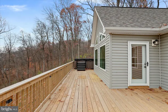 a view of a balcony with wooden floor