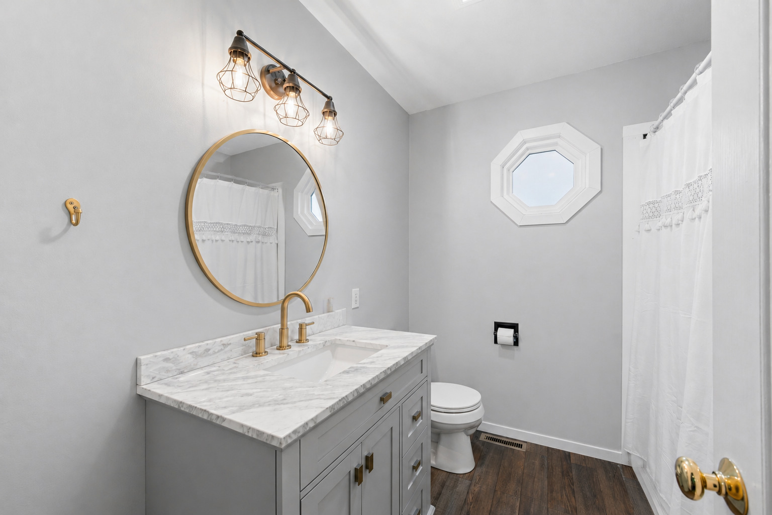 2 Bandecon Way Bloomington, IL 61704 - Photo 28 of 45 a bathroom with a toilet a sink and a mirror