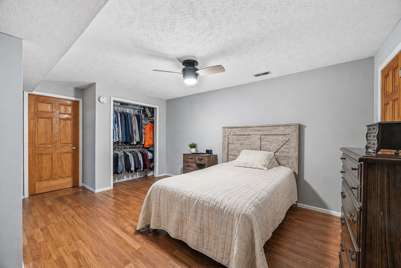 2 Bandecon Way Bloomington, IL 61704 - Photo 32 of 45 a bedroom with a bed and a chandelier