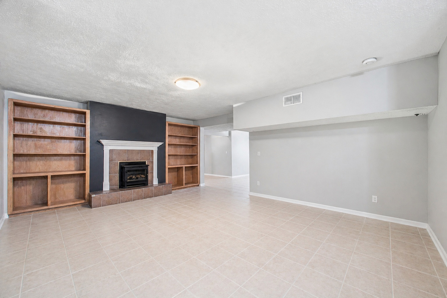2 Bandecon Way Bloomington, IL 61704 - Photo 35 of 45 a view of an empty room with a fireplace and a window
