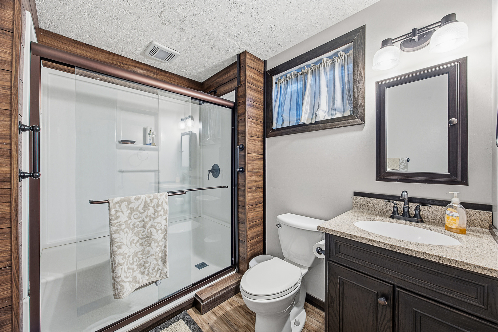 2 Bandecon Way Bloomington, IL 61704 - Photo 38 of 45 a bathroom with a granite countertop toilet a sink and a mirror