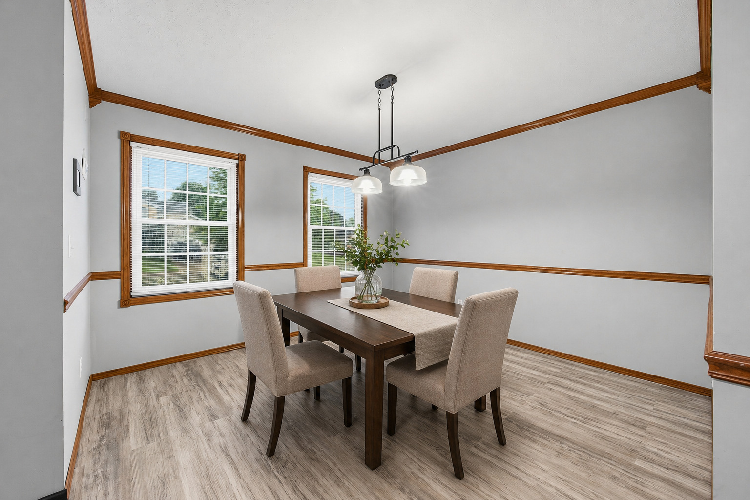2 Bandecon Way Bloomington, IL 61704 - Photo 7 of 45 a view of a dining room with furniture window and wooden floor