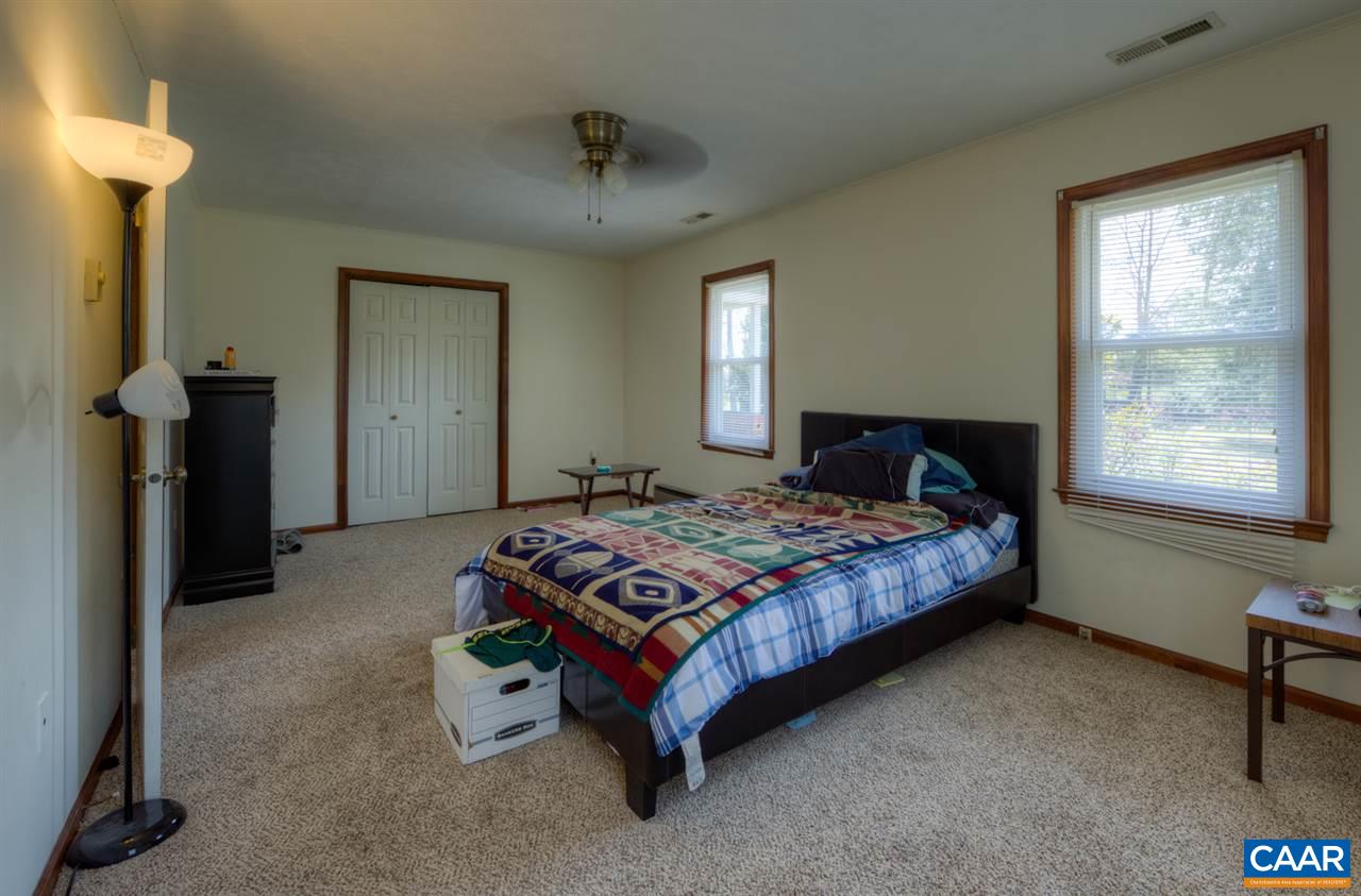27 Abe Road, Unit A & B Ruckersville, VA 22968 - Photo 31 of 44 a bedroom with a bed and a table