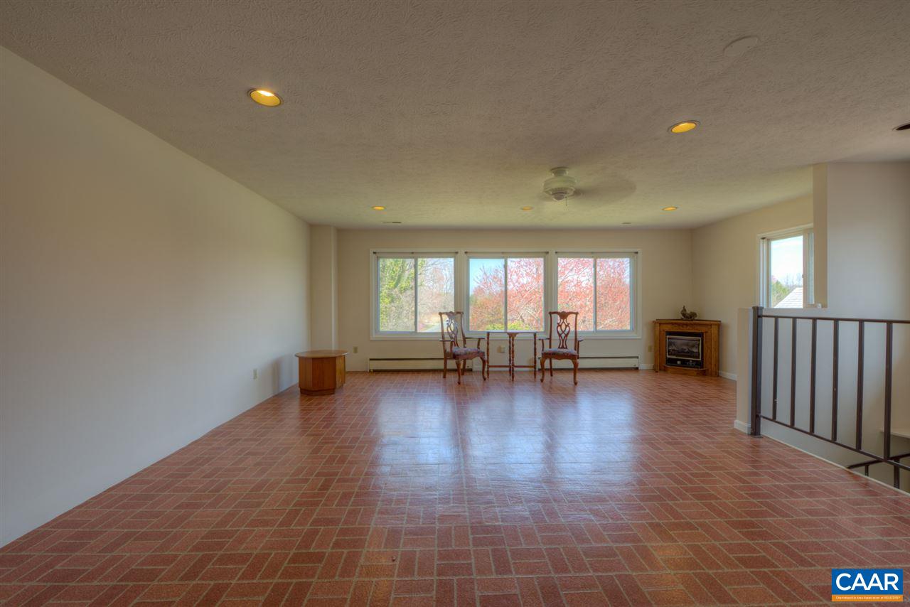 27 Abe Road, Unit A & B Ruckersville, VA 22968 - Photo 7 of 44 a view of empty room with wooden floor and floor to ceiling window