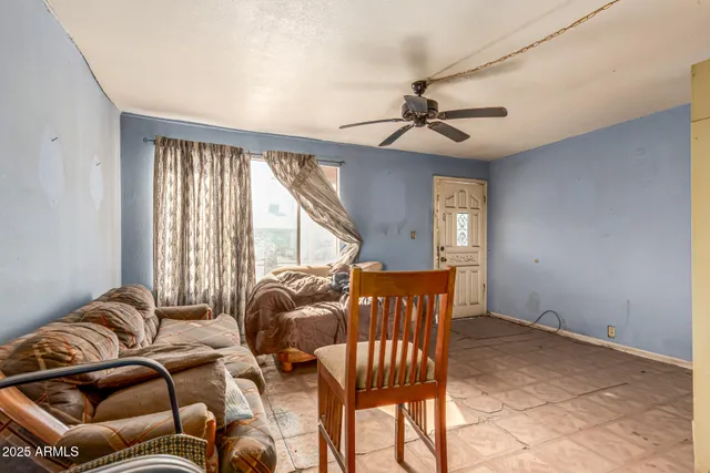 a kitchen with a stove a refrigerator and a table