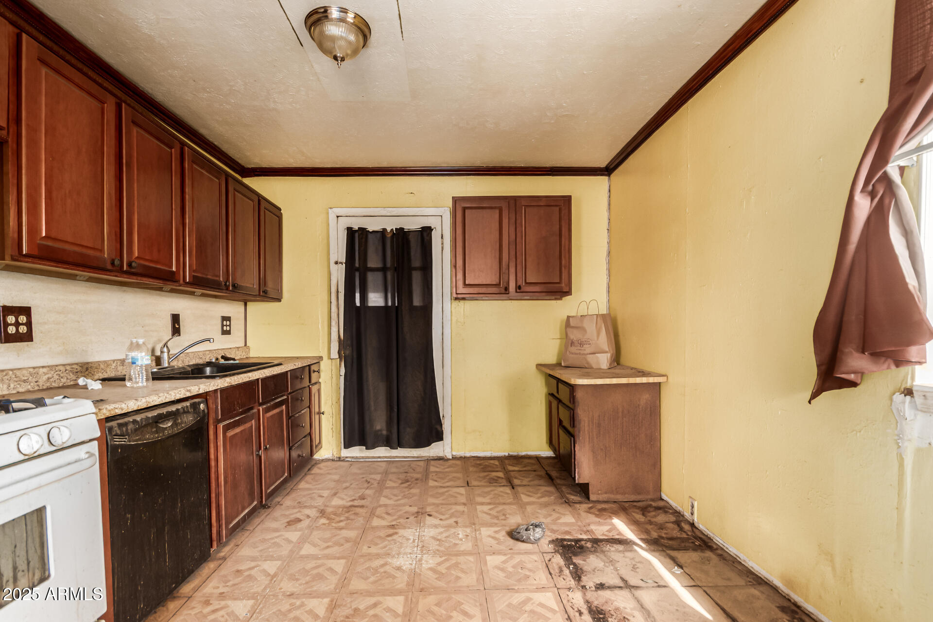 616 West Mobile Lane Phoenix, AZ 85041 - Photo 13 of 29 a kitchen with stainless steel appliances granite countertop a stove a sink dishwasher and a refrigerator