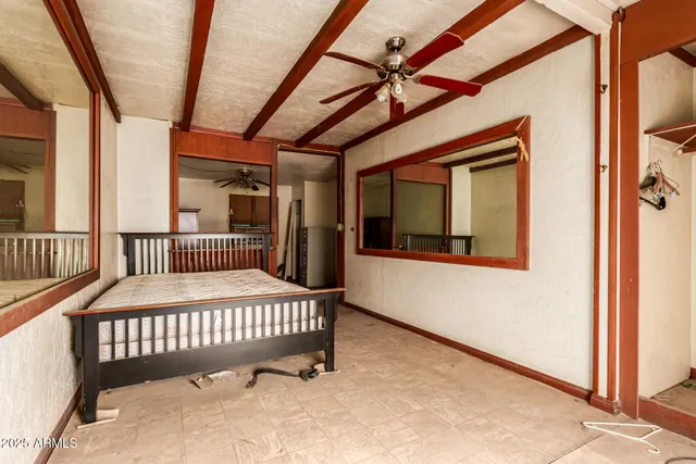 a balcony with a table and chairs