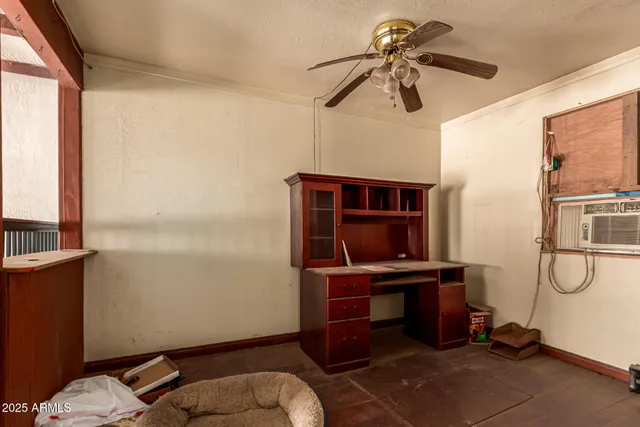 a view of livingroom with furniture and a large window