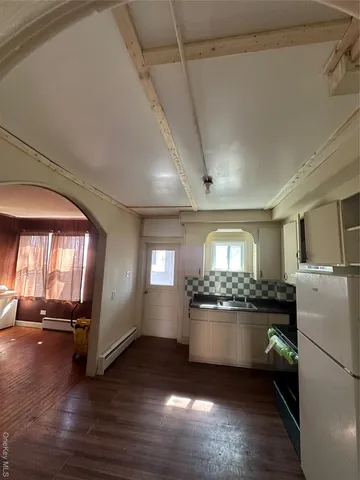 a kitchen with a stove and a refrigerator