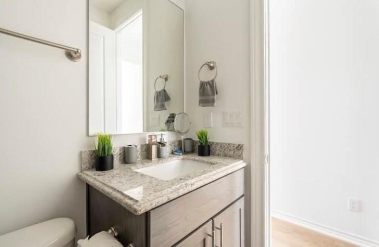 3231 Real Street, Unit B Houston, TX 77087 - Photo 14 of 25 a bathroom with a granite countertop sink and a mirror