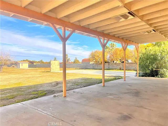 a view of a house with swimming pool and sitting area