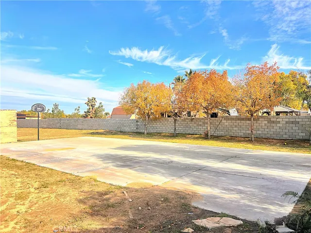 a view of a swimming pool and an outdoor seating