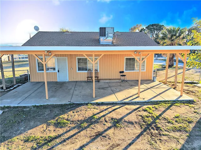 a view of a yard with furniture