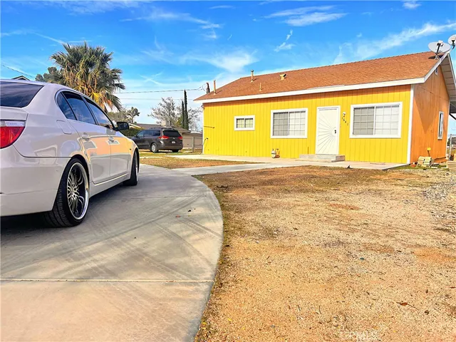 a front view of a house with parking space