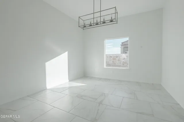 a view of entryway and hall with a front door