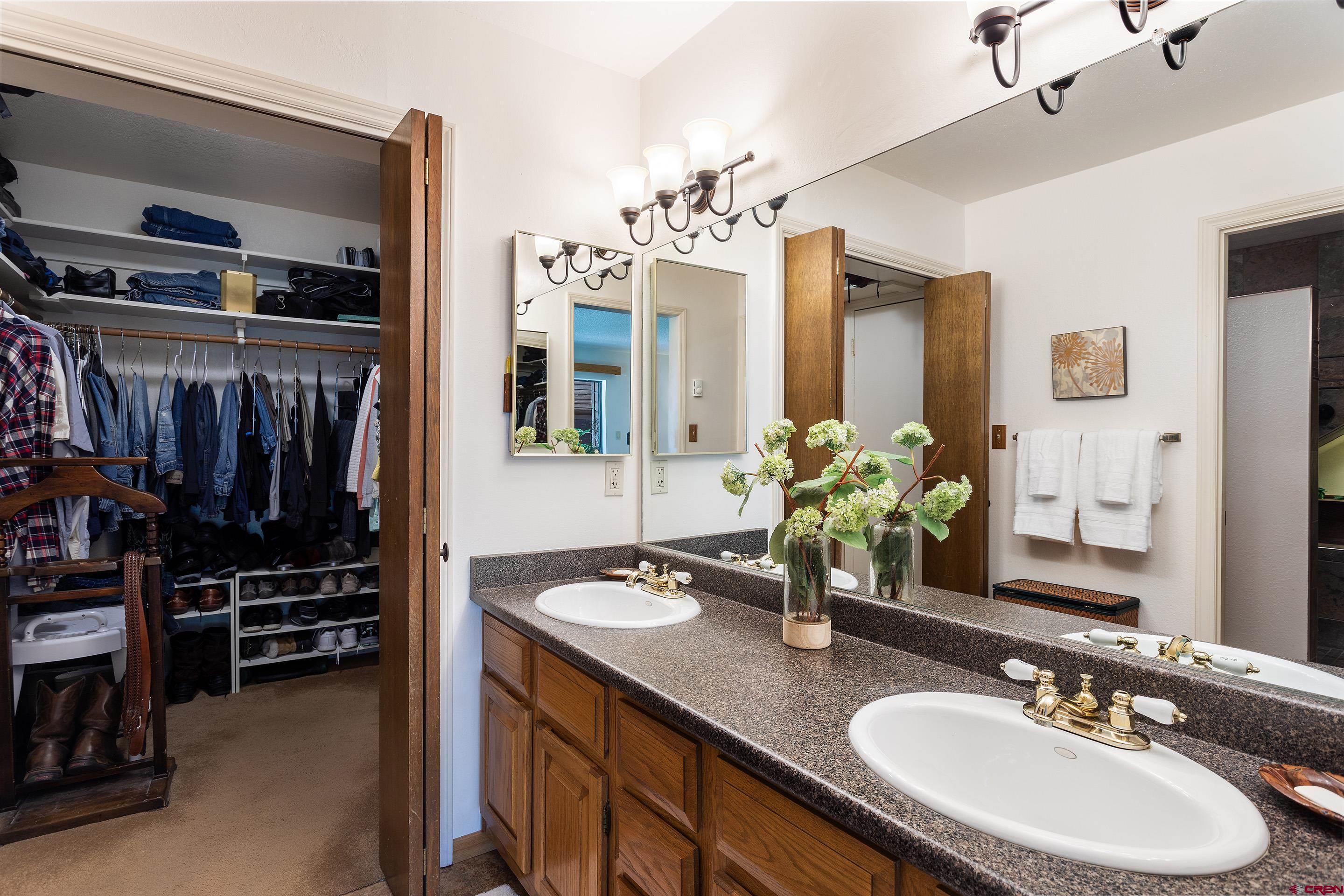 30 Moenkopi Drive Durango, CO 81301 - Photo 14 of 35 a bathroom with a sink double vanity granite and a mirror