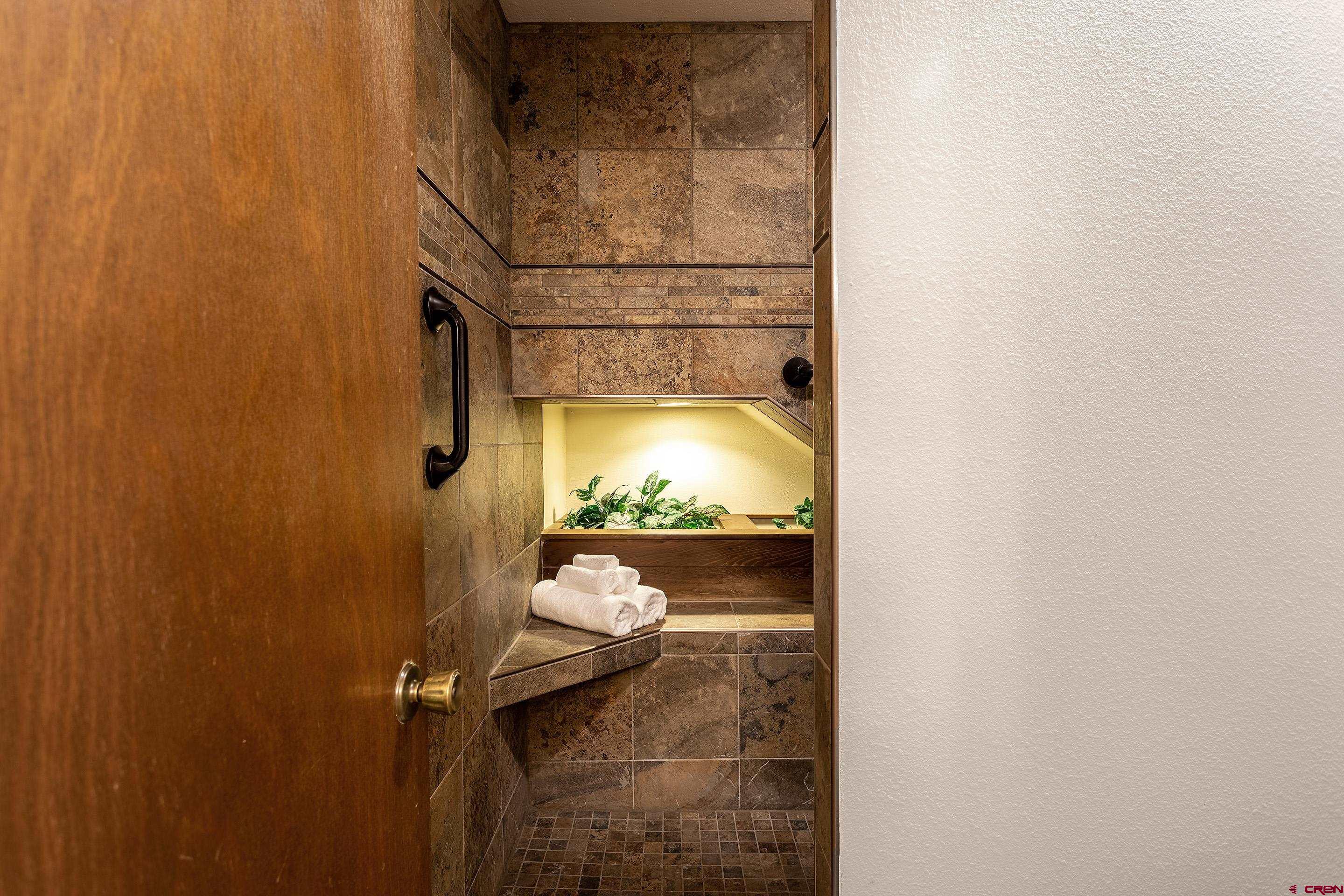 30 Moenkopi Drive Durango, CO 81301 - Photo 15 of 35 a bathroom with a granite countertop shower and a sink